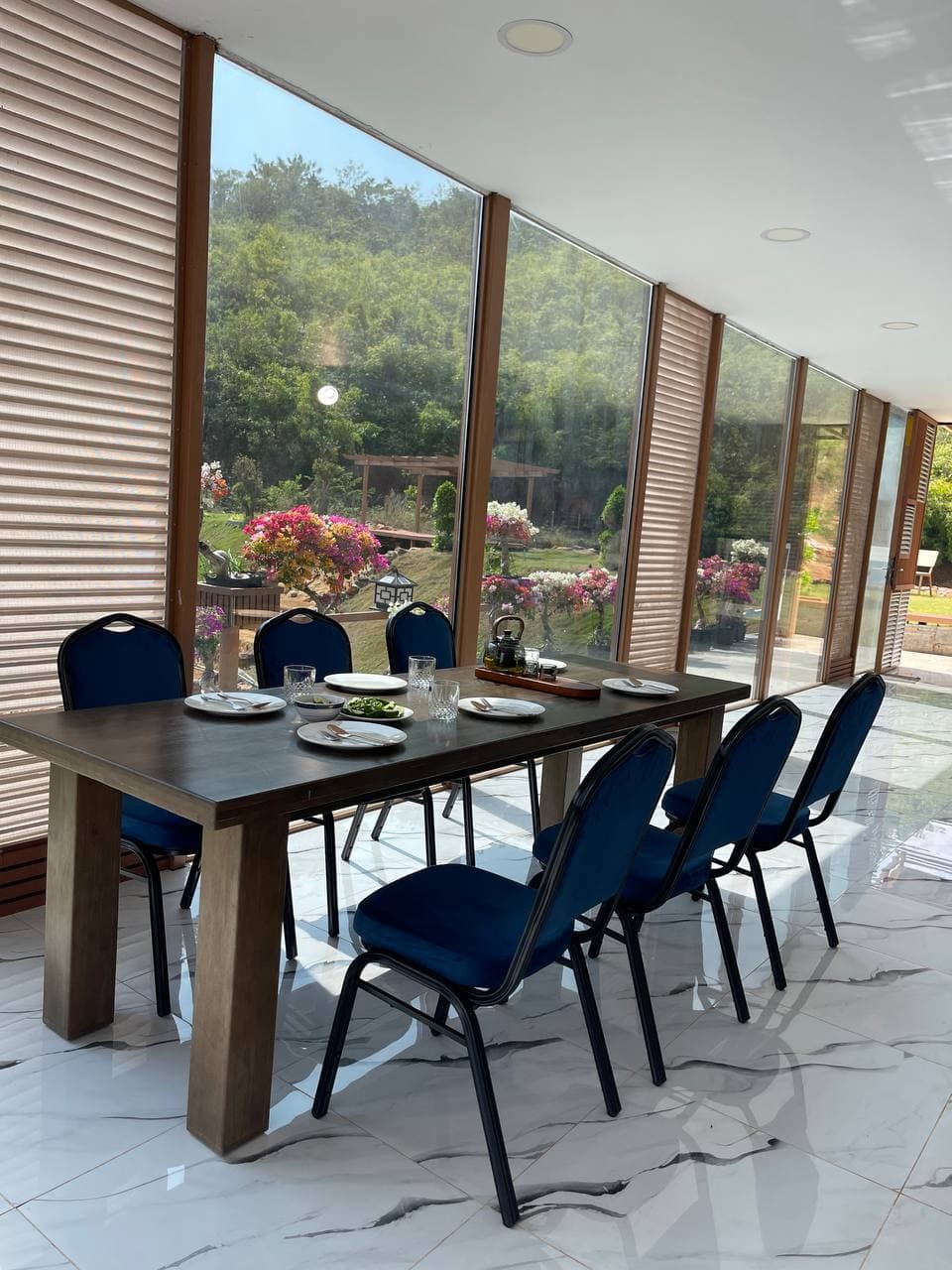 Dining room with panoramic garden and mountain view