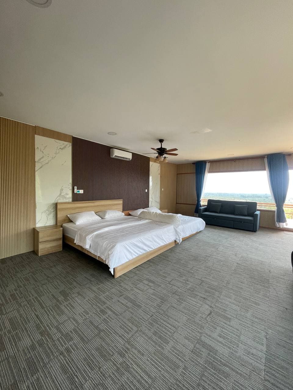 Room with large window overlooking countryside